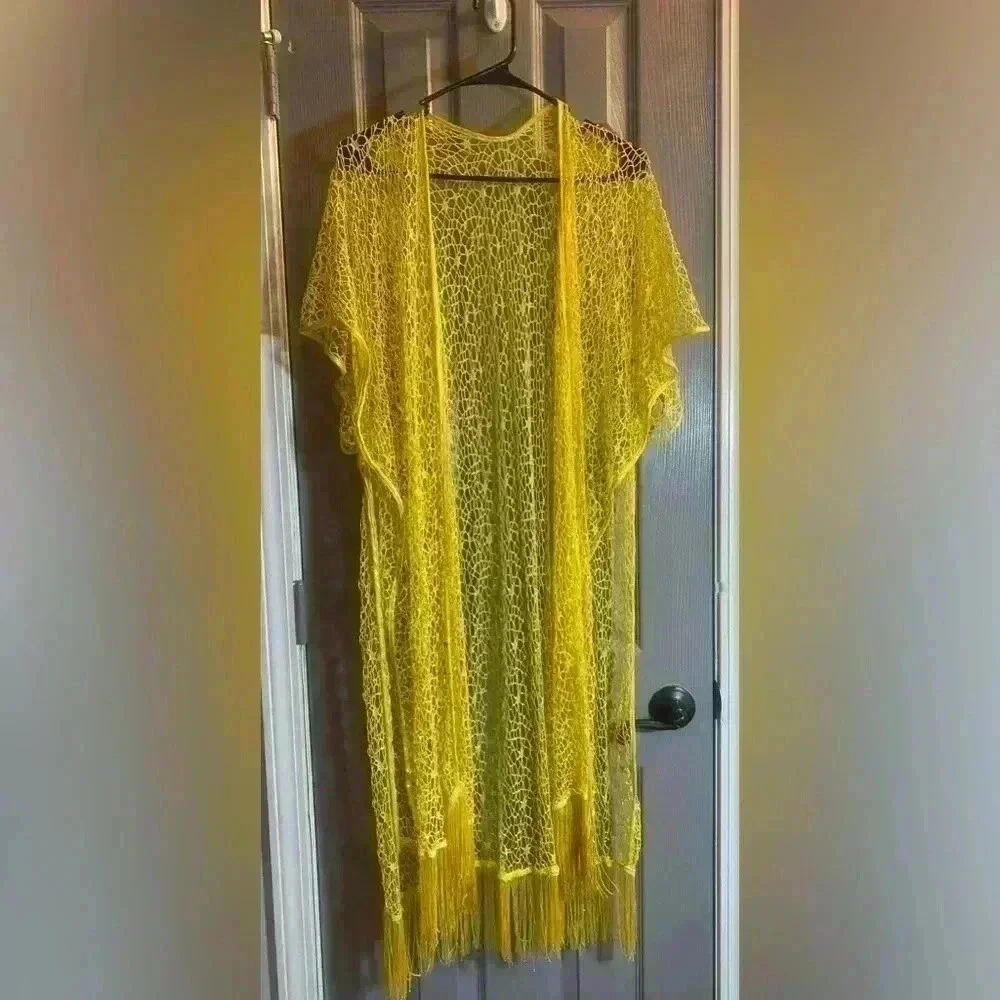 Yellow coverup for swimsuit or casual wear. Fits like a medium